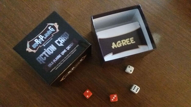 Open woRdPlayinG box with dice and card front showing